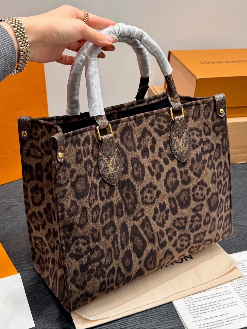 Louis Vuitton Leopard-Print Tote in Brown